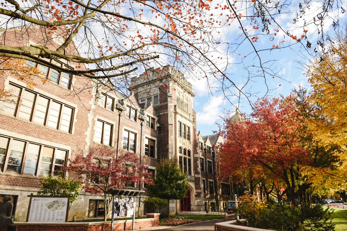 Image of colorful fall trees and stone academic buildings on Muhlenberg College's campus.